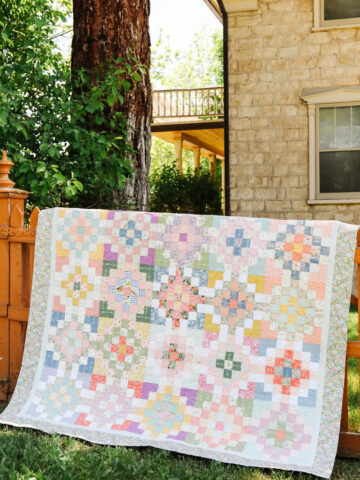 Spring pastel/Easter scrap patchwork quilt made by Amy Smart using the Checkered Garden quilt pattern from Film in the Fridge.
