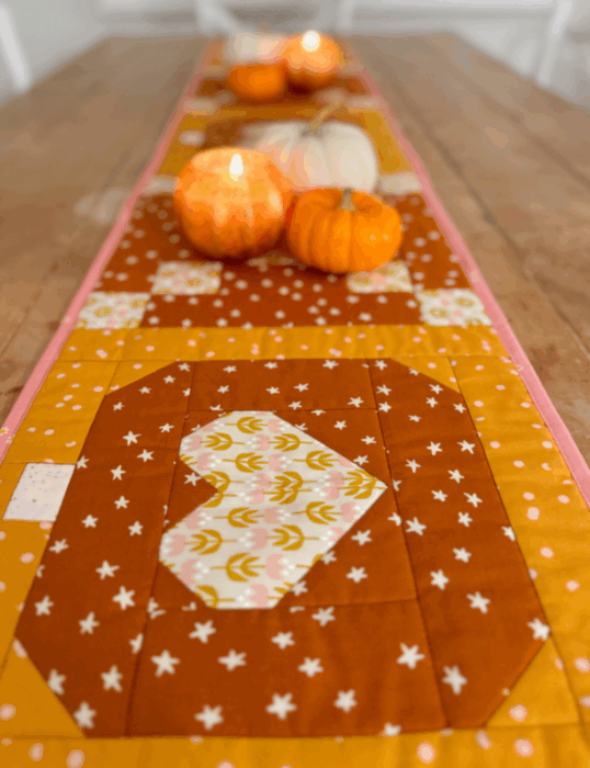 Quilted Fall table runner by Stacey Lee Creative featuring a pumpkin Heart quilt block