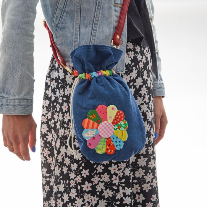Colorful fabric drawstring pouches with cheerful dresden applique