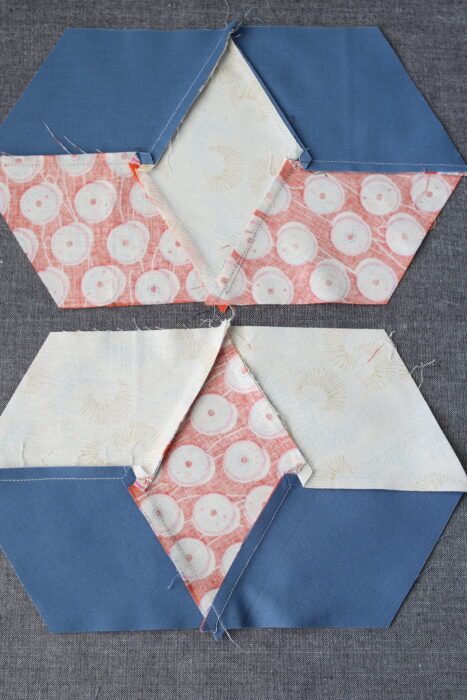 Pressing guide showing seam directions for a 60-degree diamond star quilt block.