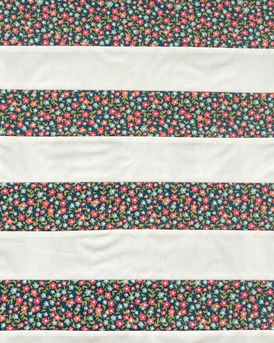 Alternating Fabric A and Fabric B strip set sewn together for the checkerboard.