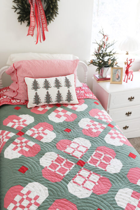 CHristmas quilts inspired by traditional woven Scandinavian paper hearts