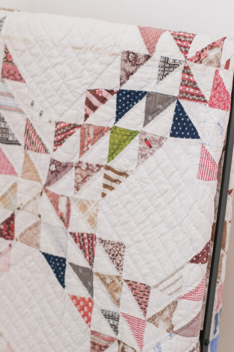 Antique Ocean Waves quilt - close up of vintage fabrics in half square triangles