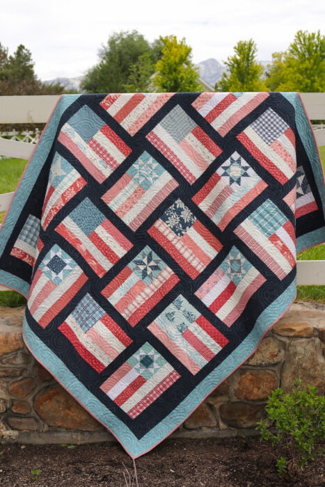 Fly the Flag - Americana quilt pattern by Amy Smart in faded reds, whites, blues with navy sashing