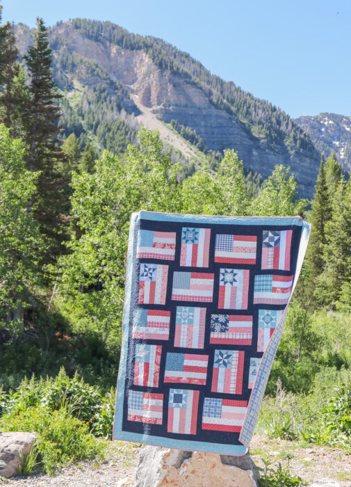 Fly the Flag - Americana quilt pattern by Amy Smart of Diary of a Quilter. Made with faded reds, whites, blues scraps with navy sashing