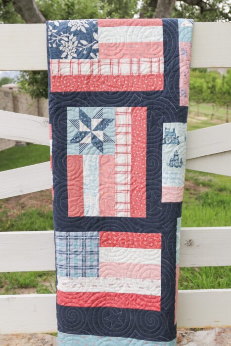 Fly the Flag - Americana quilt pattern by Amy Smart of Diary of a Quilter. Made with faded reds, whites, blues scraps with navy sashing