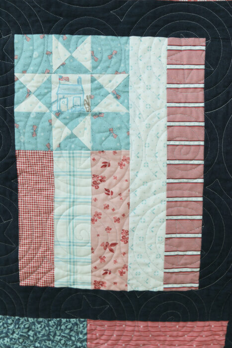 Fly the Flag - Americana quilt pattern by Amy Smart in faded reds, whites, blues with navy sashing