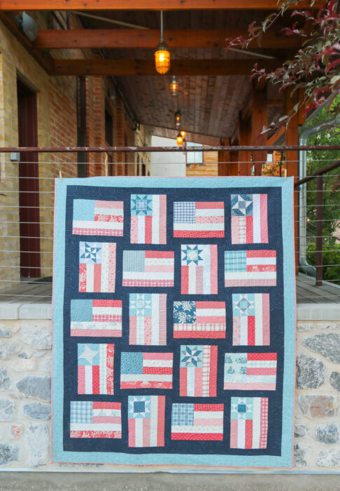 Fly the Flag - Americana quilt pattern by Amy Smart of Diary of a Quilter. Made with faded reds, whites, blues scraps with navy sashing