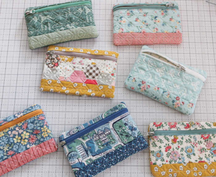 Lined zipper pouches made in a machine embroidery hoop with free pattern from Kimberbell